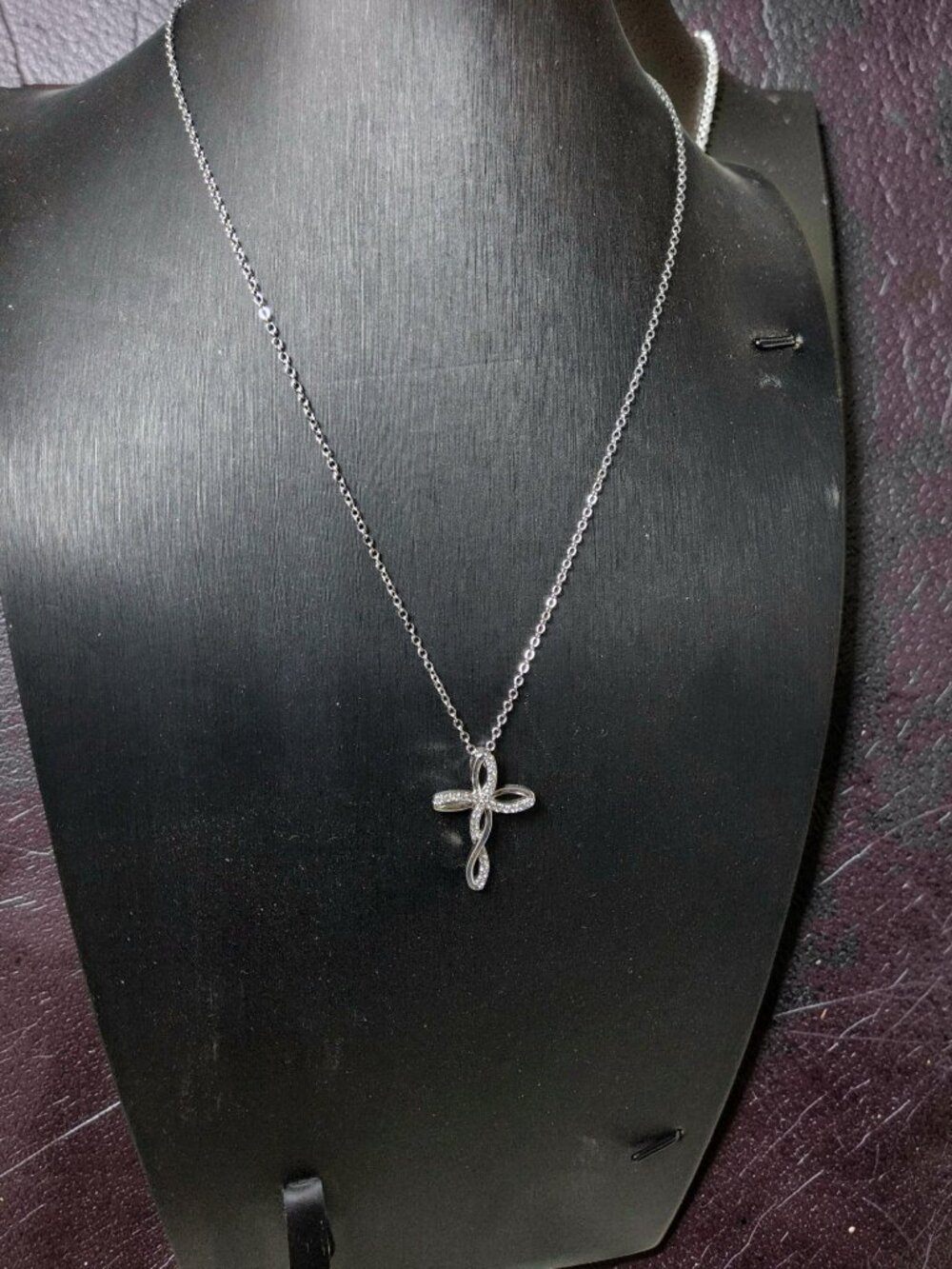 vintage Chrystal lined spiraled curled cross on a .925 sterling necklace